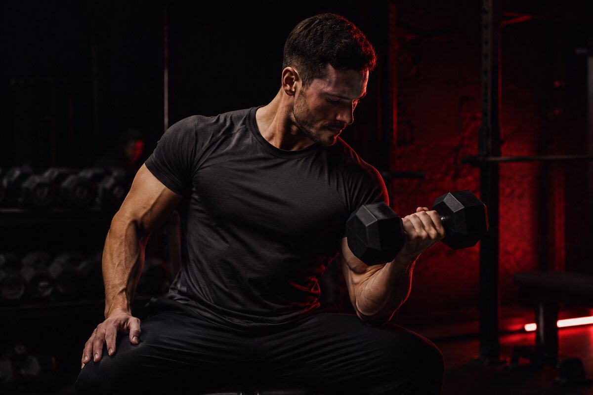 an athletic man building a balanced V-taper with realistic strength training
