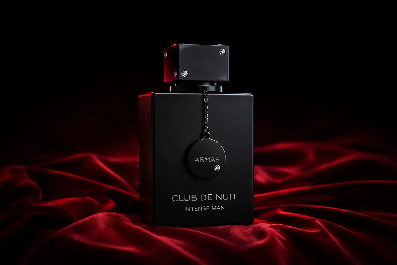 Editorial image of Armaf Club de Nuit Intense Man on red silk