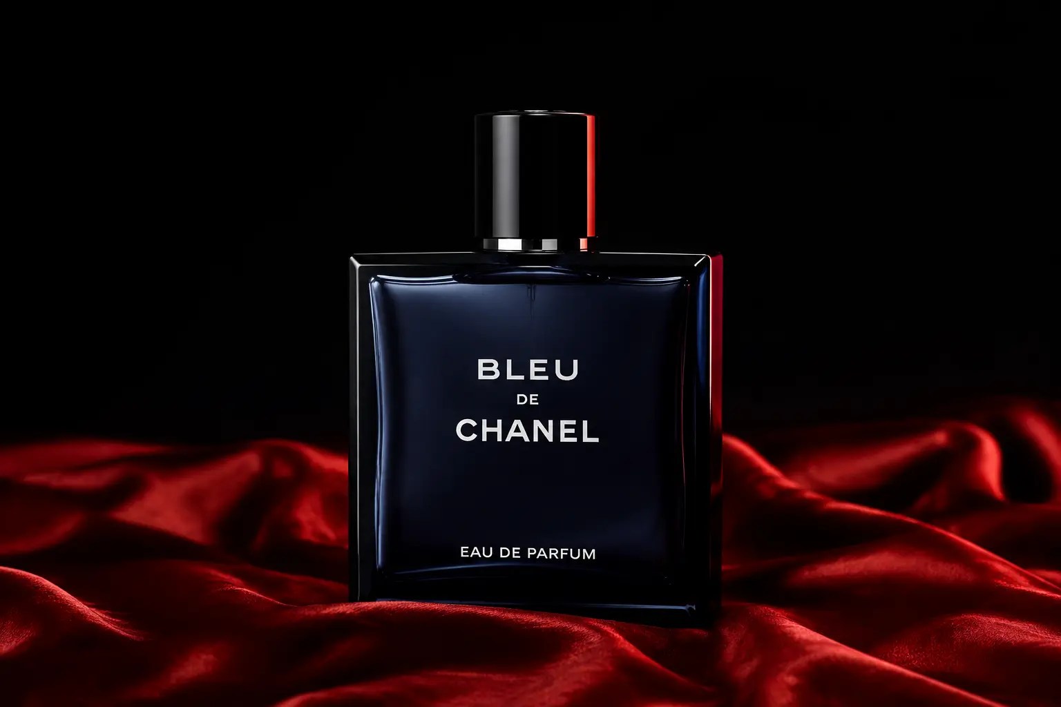 Editorial image of Bleu de Chanel Eau de Parfum on red silk