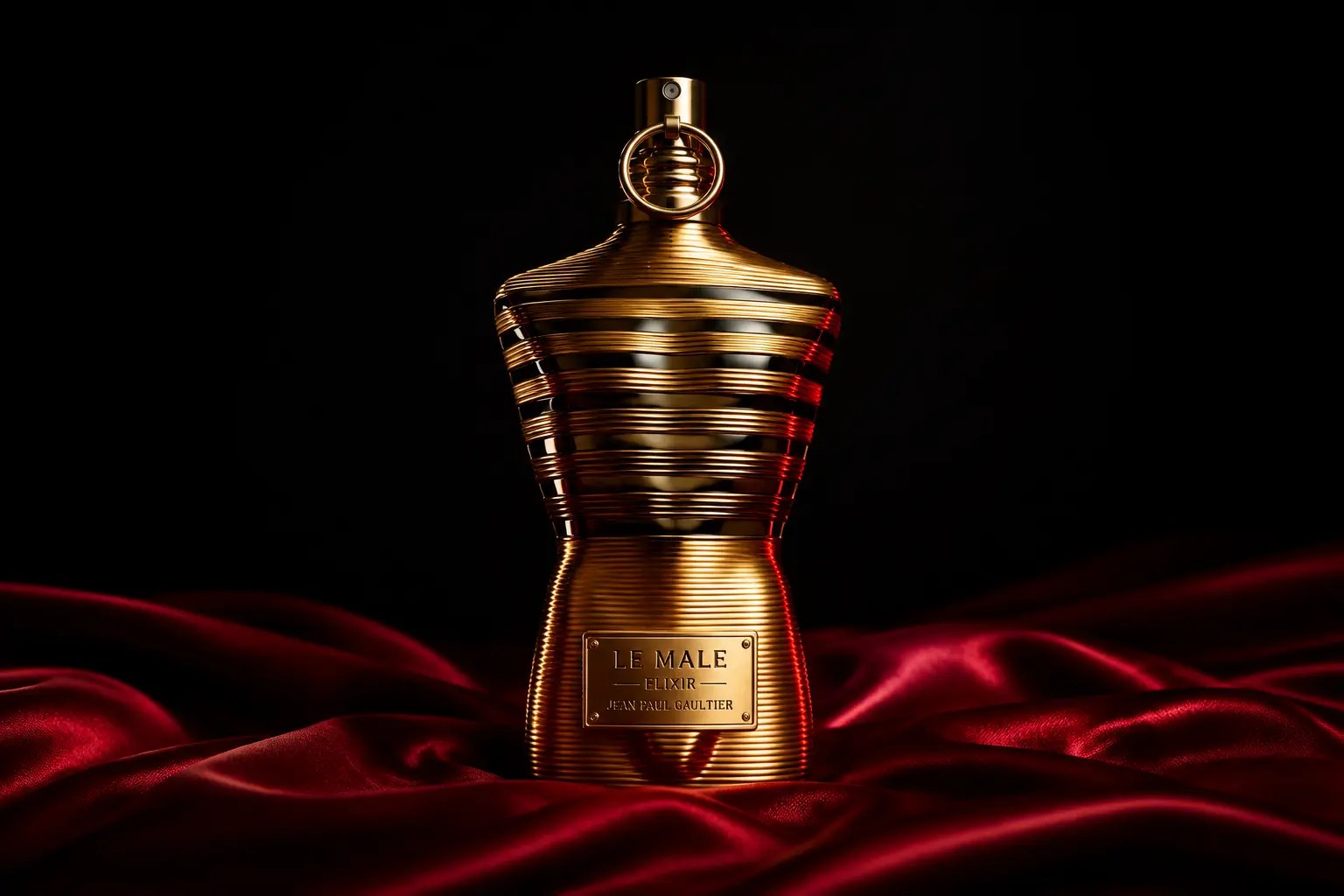 Editorial image of Jean Paul Gaultier Le Male Elixir on red silk