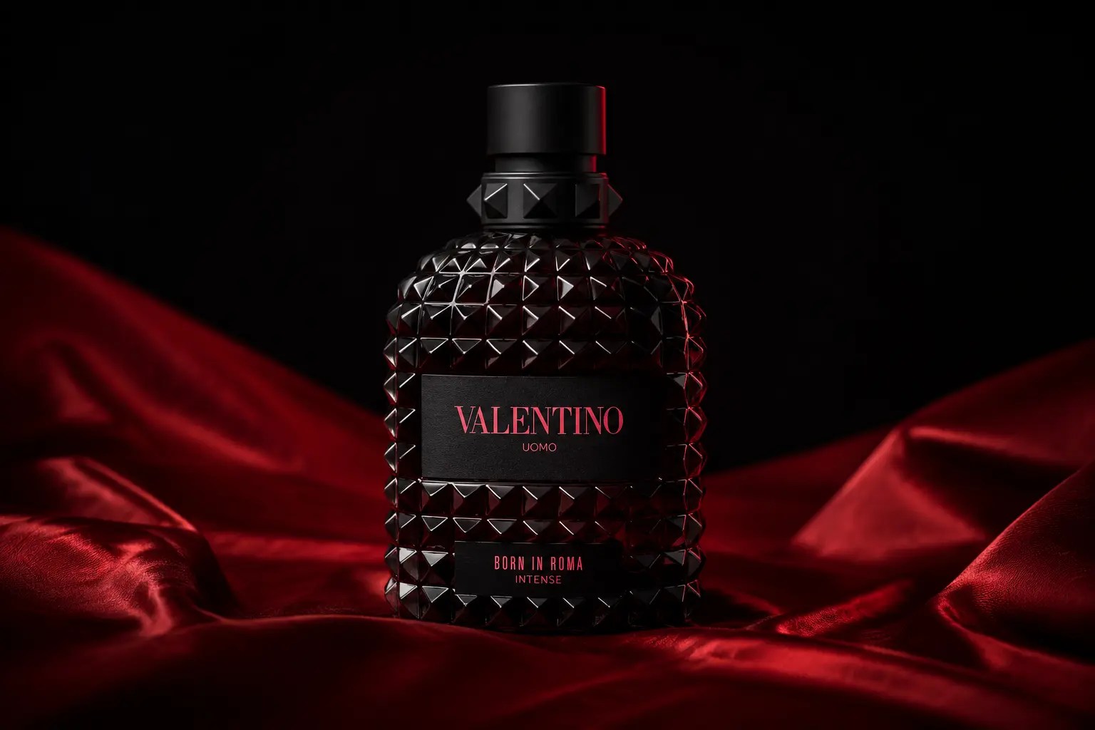 Editorial image of Valentino Uomo Born in Roma Intense on red silk