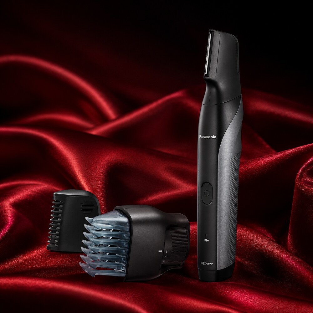 Panasonic ER-GK80-S body groomer and attachments displayed on deep red silk