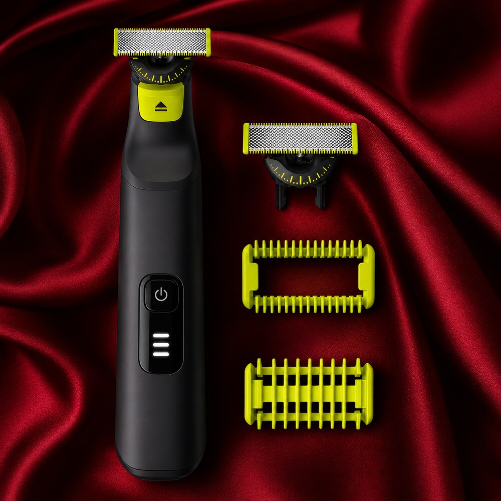 Philips Norelco OneBlade Pro 360 QP6542/70 and grooming attachments displayed on deep red silk