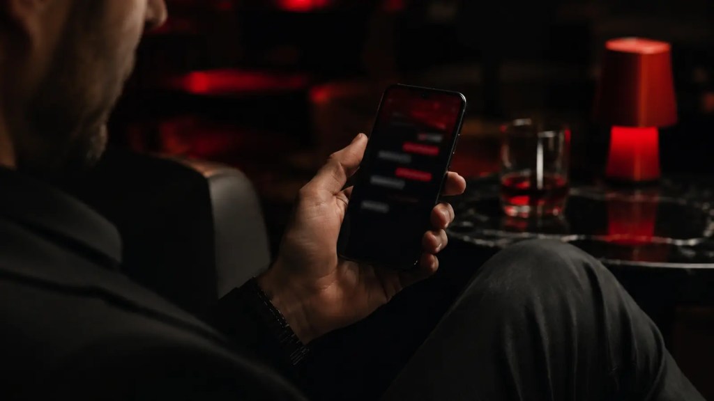 Man pausing before replying to a message